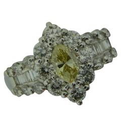 Estate Fancy Light Yellow Diamond and White Diamond Halo Ring