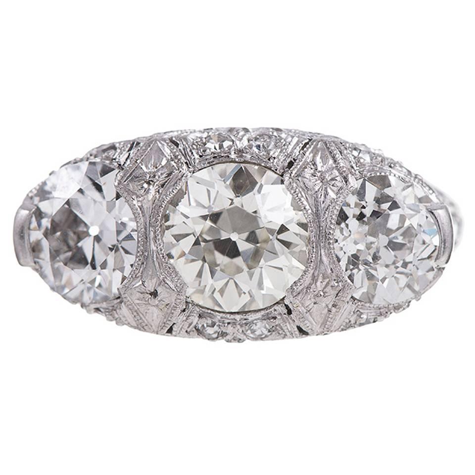 2.60 Carat English Carved Style Art Deco Three Stone Diamond Ring