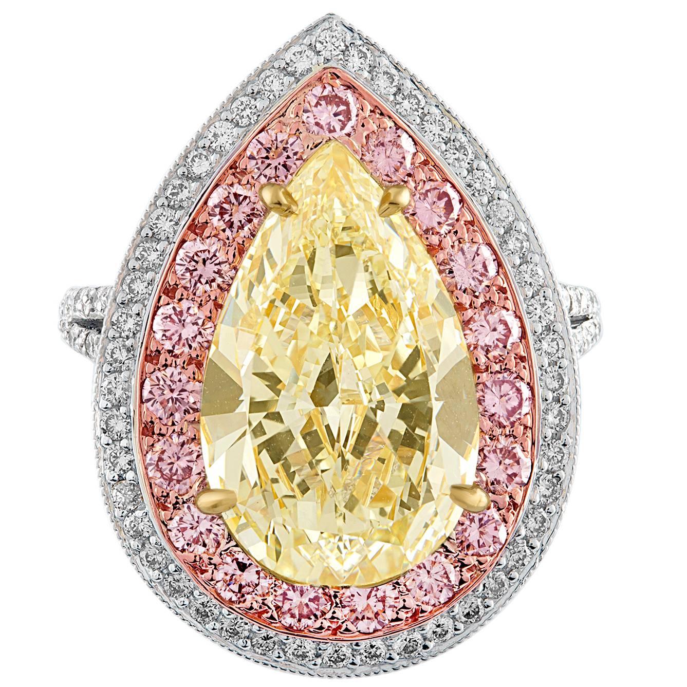 6.92 Carat Pear Shape Light Yellow Ring of Three Colors