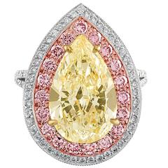 6.92 Carat Pear Shape Light Yellow Ring of Three Colors