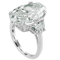 8.08 Carat Oval Shape is set in Platinum Ring with Half Moons.