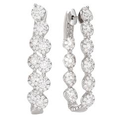 Oval diamond in and out hoop earrings