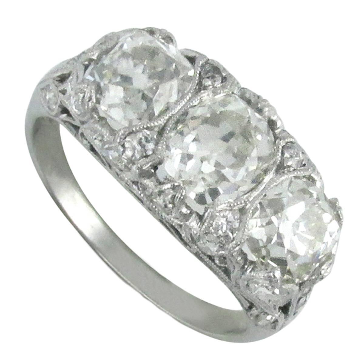 Edwardian Diamond Platinum Three Stone Filigree Ring For Sale
