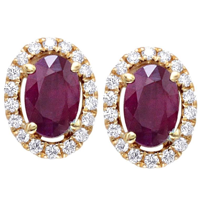 1.27 Carats Oval Ruby Halo Diamonds Gold Stud Earrings For Sale