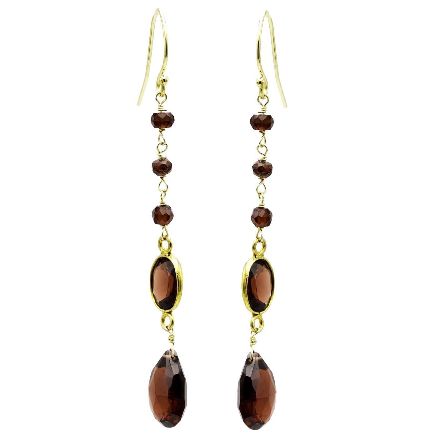 Faceted Garnet and Gold Dangling Earrings in a Tapered Design
