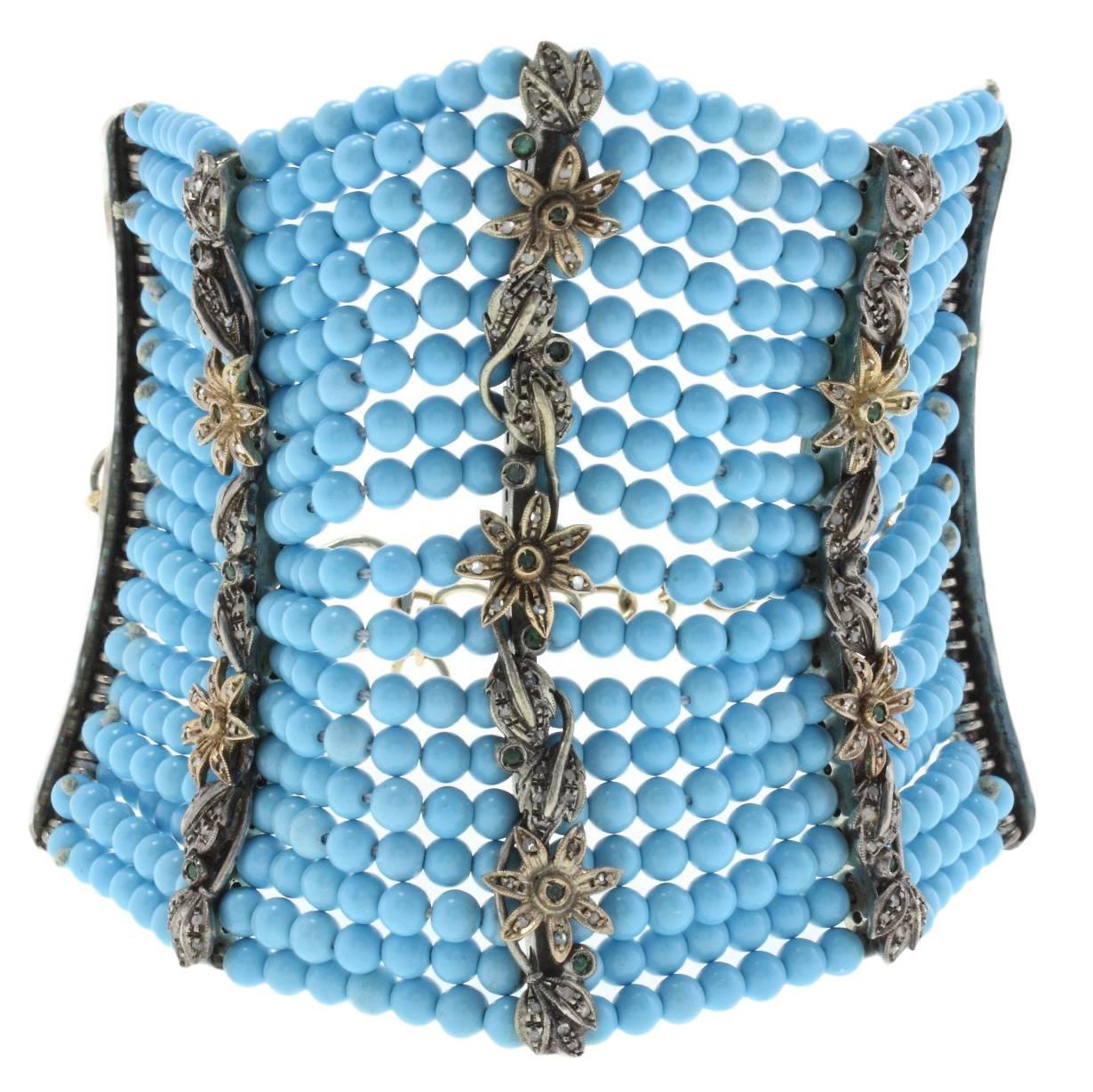 Bracelet en or et argent avec turquoises, diamants et émeraudes