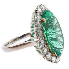 Colombian Oval cut Emerald and diamond halo ring