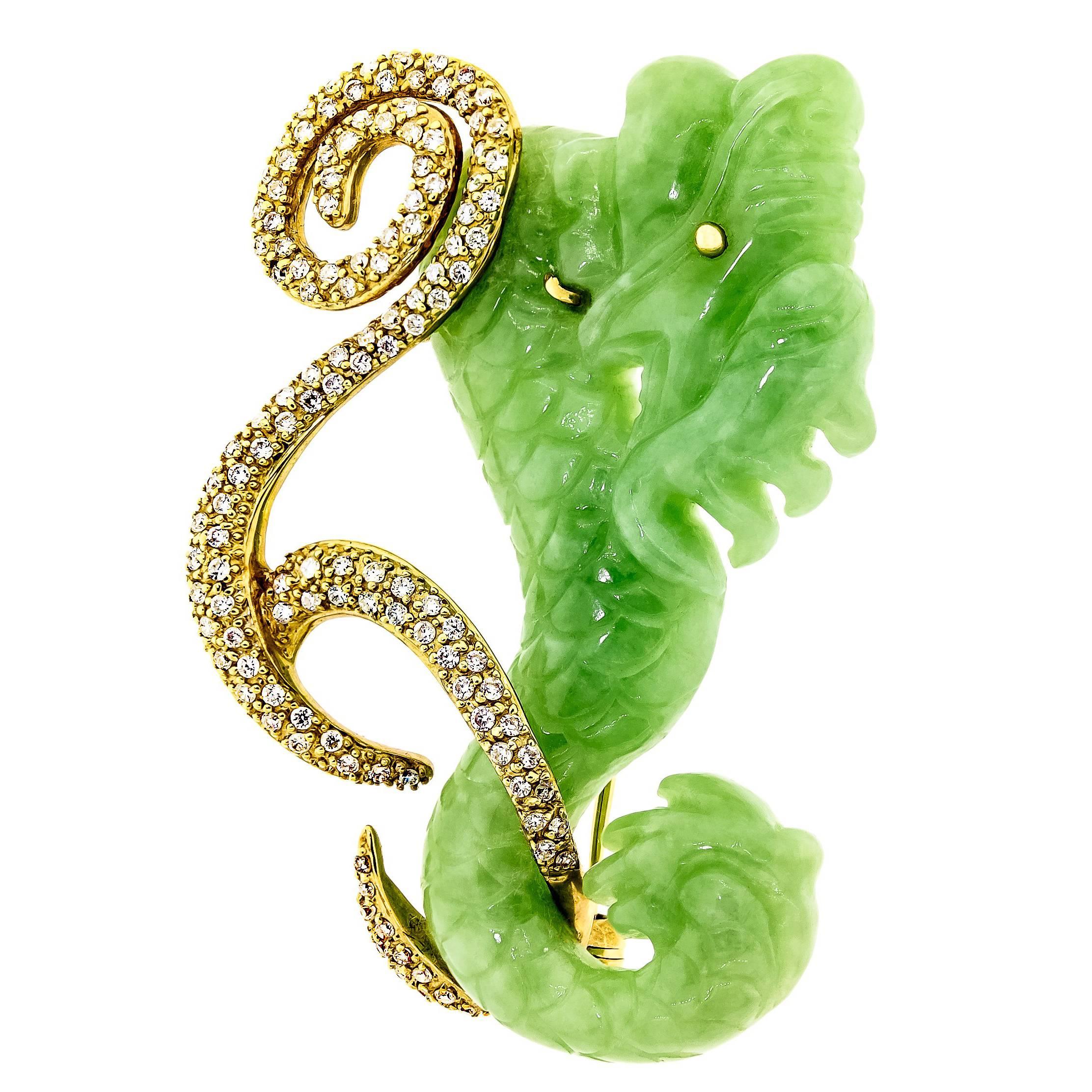 Vintage 14kt yellow gold jade and diamond dragon brooch consisting of a carved jade dragon with gold diamond set scrollwork containing 132 round brilliant cut diamonds H-1 color, SI1 clarity weighing approximately 0.39 cts total weight. Stamp: 14k