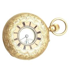 Montre de poche ancienne en or jaune pour dame:: demi chasseur