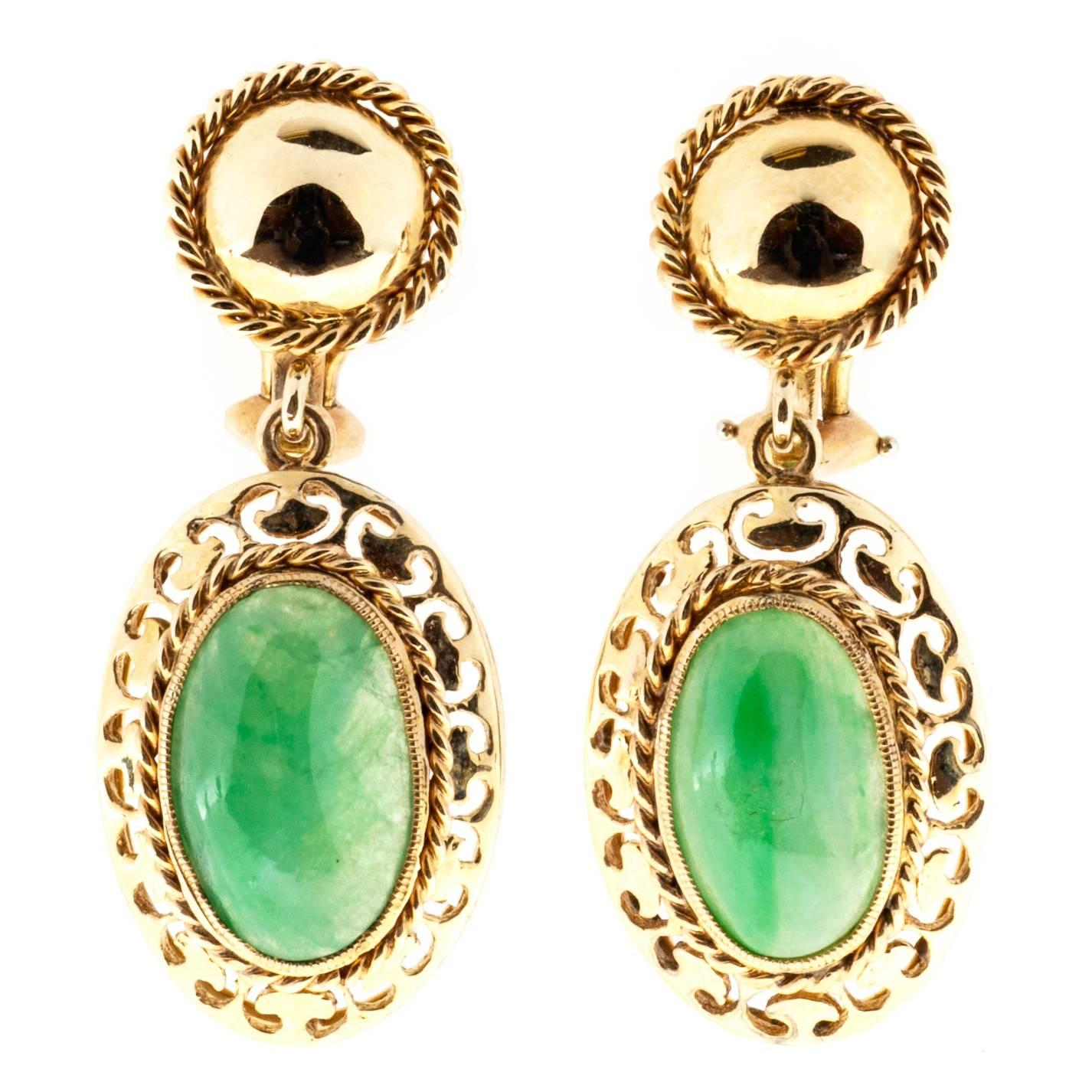 1940's Jadeite jade 14k yellow gold dangle earrings. Clip and post style. The bottom dangle holds 