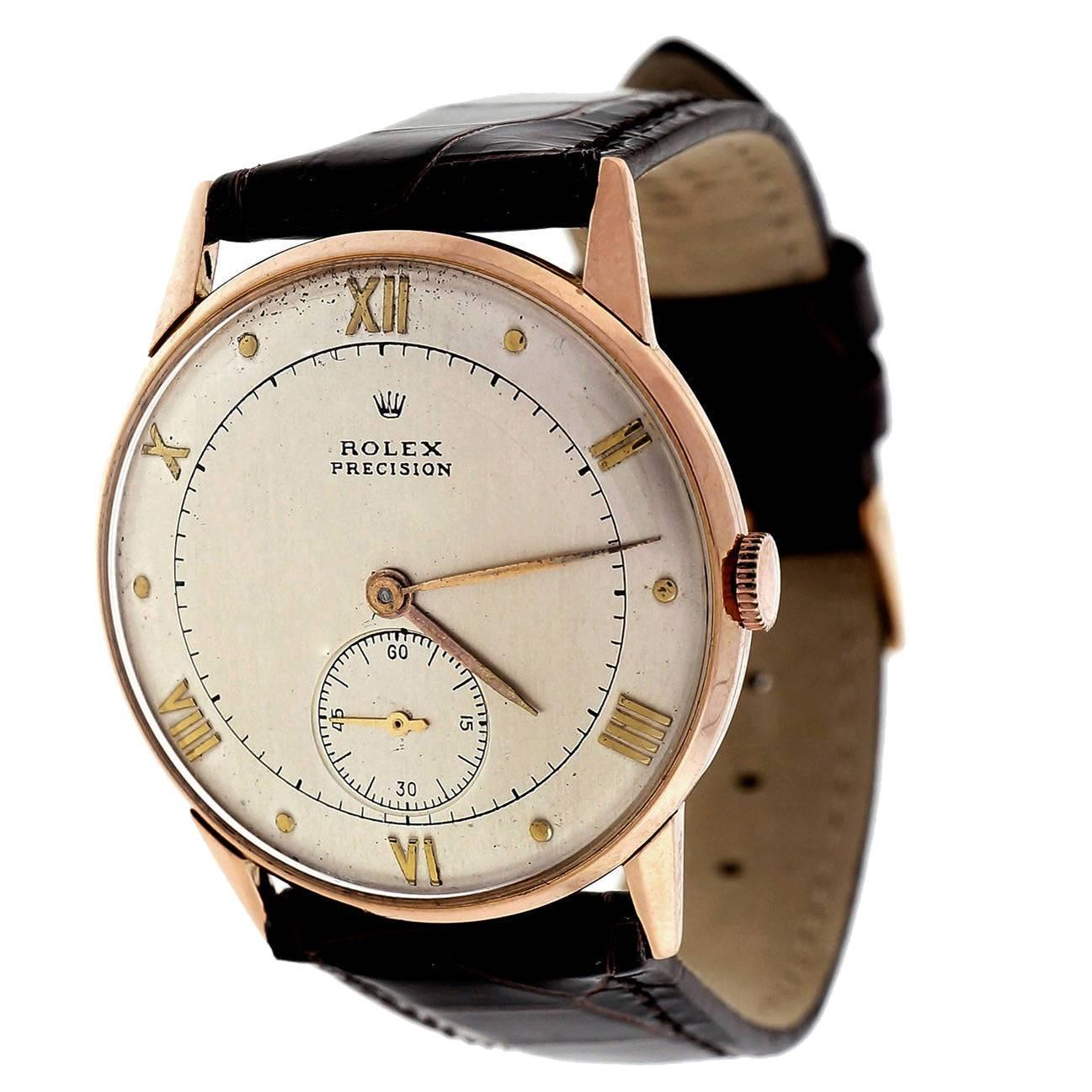 Late 1940’s very fine Rolex Precision Super Balance 3667 18k pink gold watch with brown Alligator band and original 18k pink gold Rolex buckle. The finest example of early Rolex dress watch we have seen in years.

18k pink gold
34.8