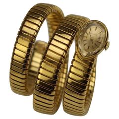 Retro Bulgari Ladies Yellow Gold Juvenia Tubogas Snake Bracelet Wristwatch, circa 1970
