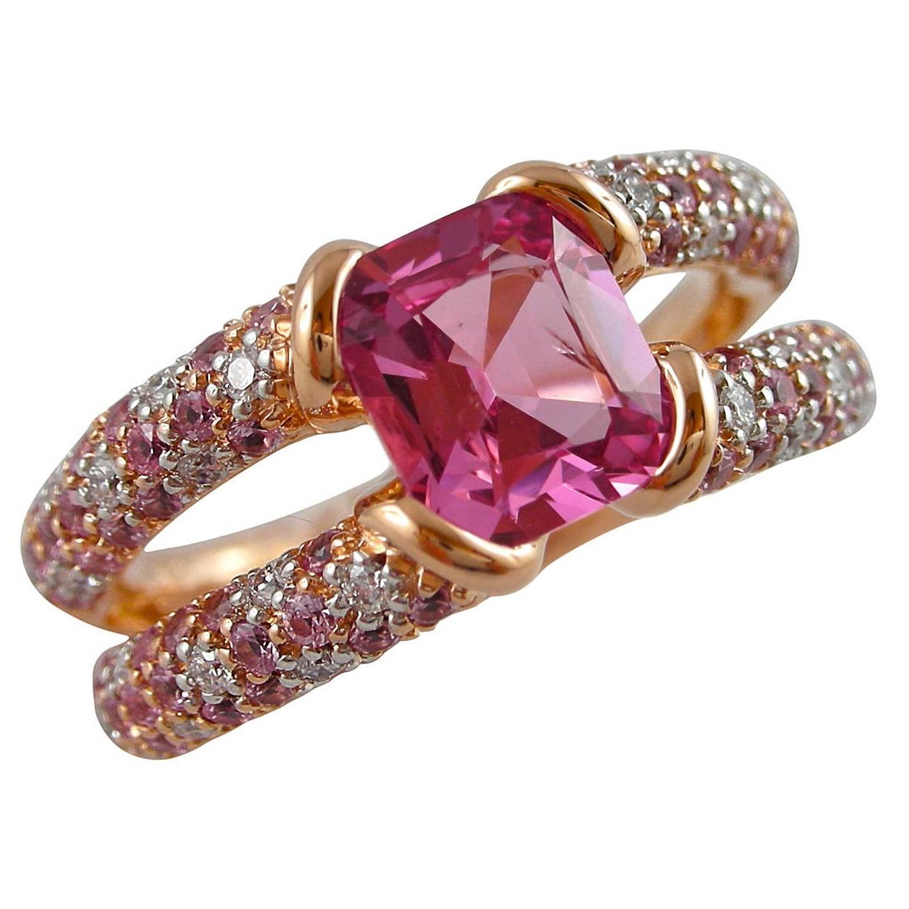 Alex Jona design collection, designed and hand crafted in Italy, 18 Karat rose gold ring, set with one Pink Spinel weighing 1,41carats. On either side of the vivid center stone a split shank set with brilliant-cut round white diamonds weighing 0.22