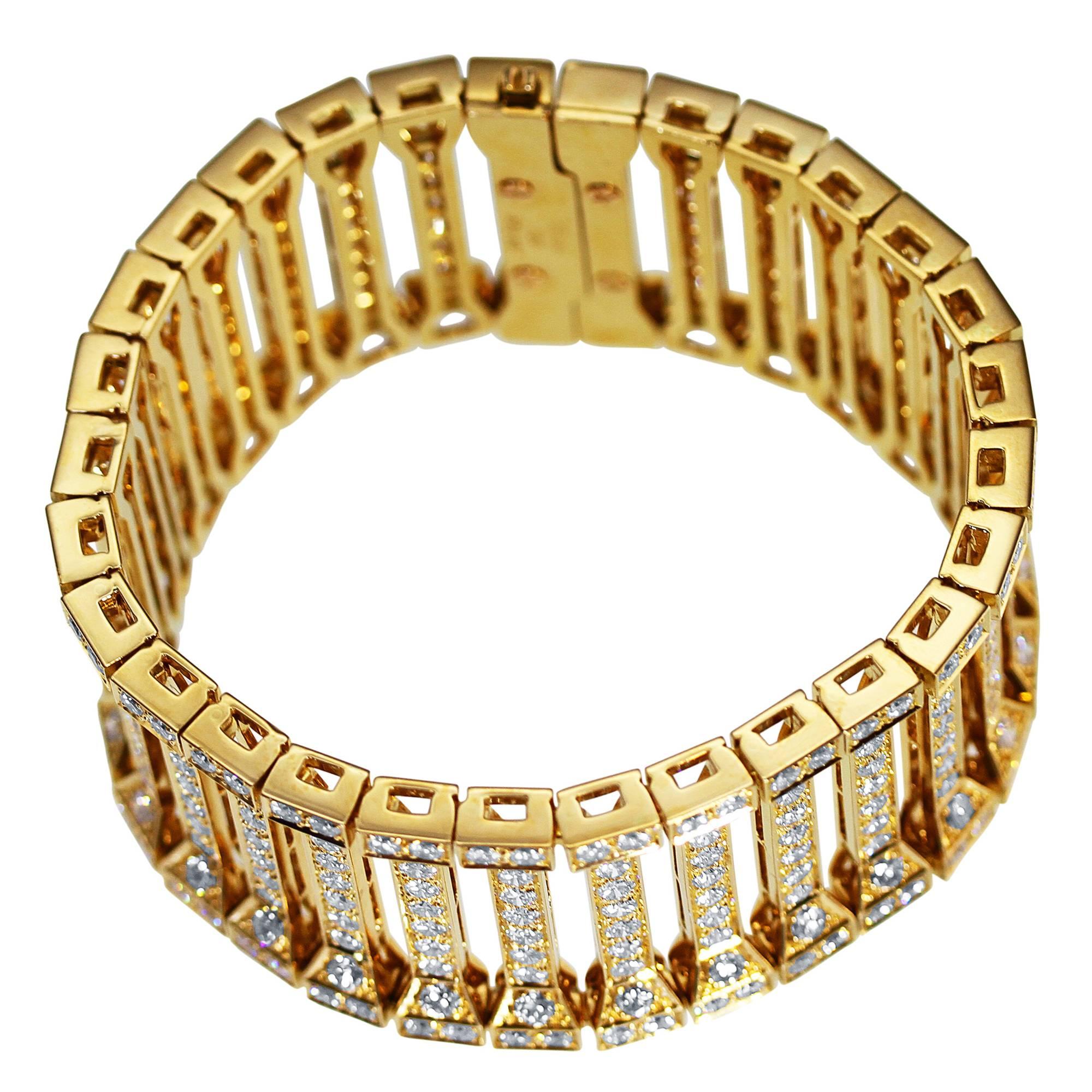 An 18 karat yellow gold bracelet by Cartier, designed as a series of openwork bars that look like columns set throughout with 358 round diamonds weighing approximately 24.50 carats, gross weight 111.1 grams, length 7 1/4 inches, width 1 1/8 inches,