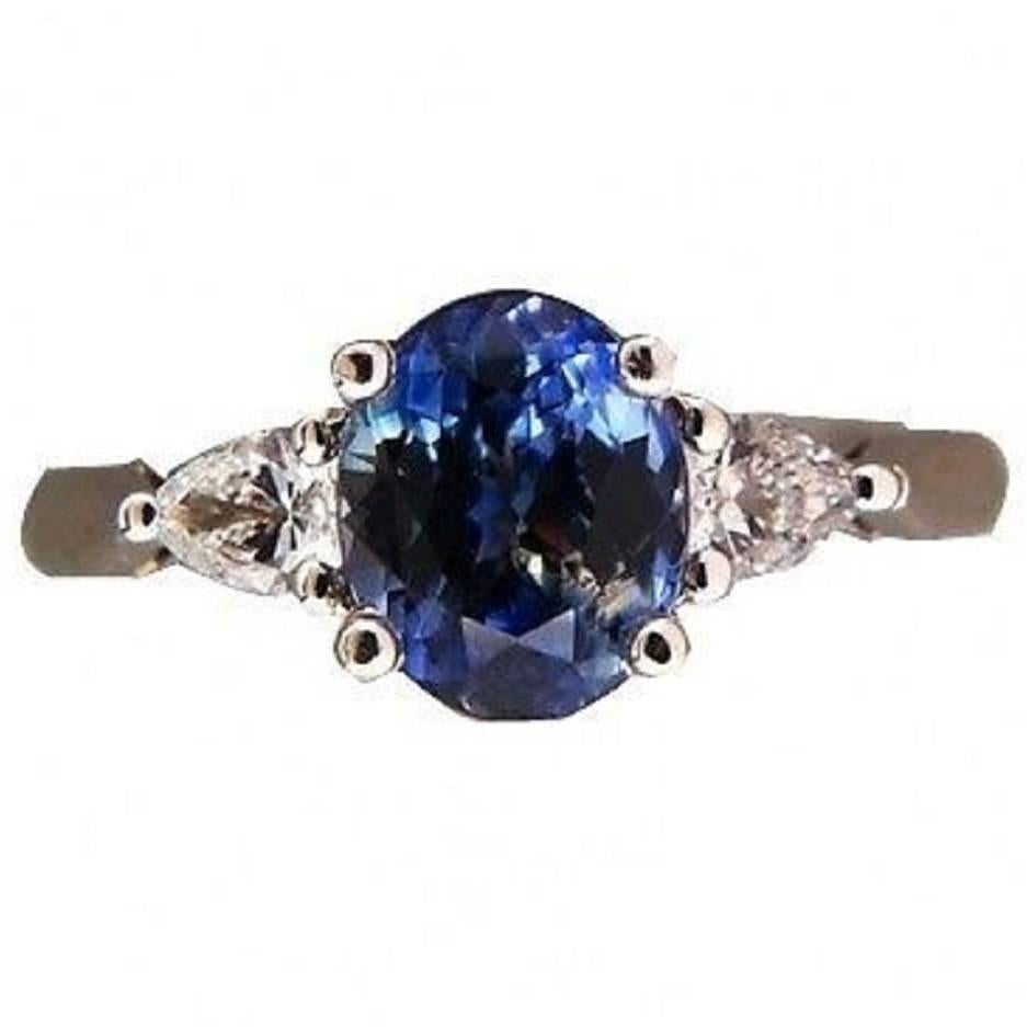 Peter Sucy natural no heat Sapphire with bright blue at the ends and light blue in the center. In a handmade Platinum setting with diamond accents. From the Peter Suchy workshop designed and made just for this stone.

1 natural oval Sapphire no heat