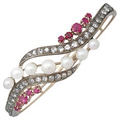 1890s Pearl 1.28 Carats Rubies 3.65 Carats Diamonds Gold Bangle Bracelet