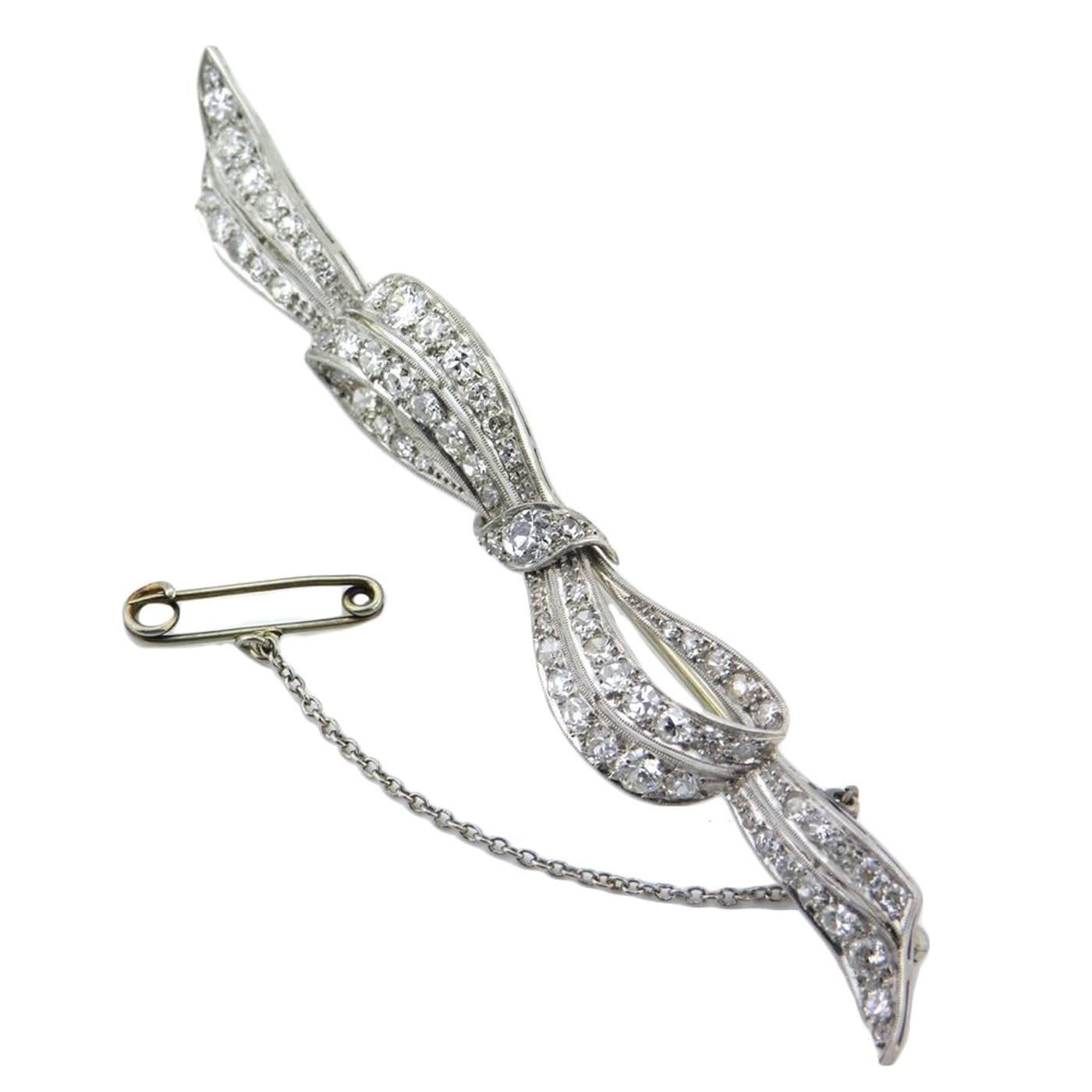 Art Deco diamond platinum bow brooch For Sale