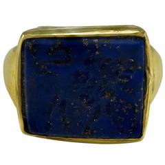 Irregularly shaped Lapis Lazuli Intaglio of a Lion in a Gold Ring mount