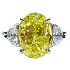 4.12 Carat Fancy Intense Yellow Oval Diamond Gold Platinum Engagement Ring