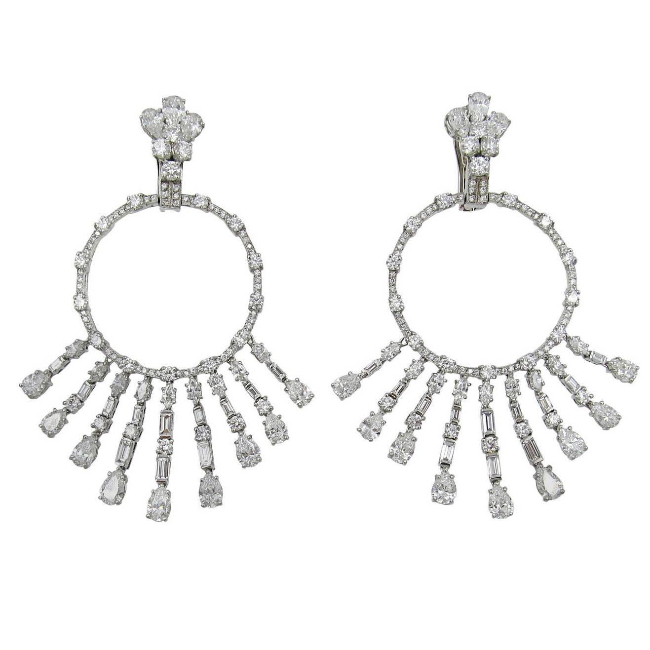 Pair of Platinum and Diamond 'Gypsy' Earrings, Graff
The diamond-set hoops suspending graduated fringes, set with numerous round, baguette, pear and marquise-shaped diamonds weighing 14carats, 
(Retails at GRAFF for $140.000.)
Maker's signature: