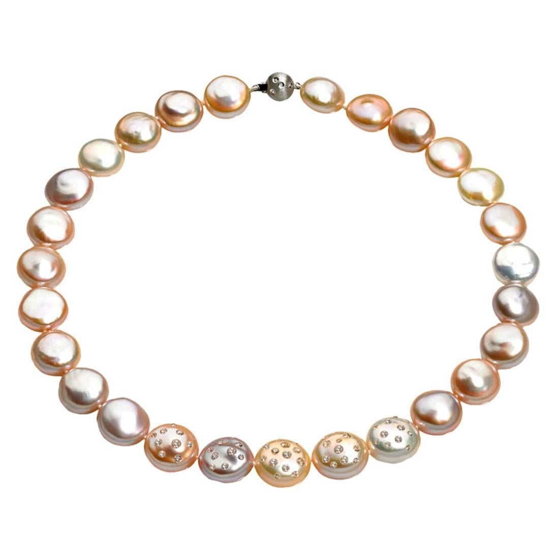 One-of-a-Kind Graduated Coin Pearl Necklace with a diamond-embedded 18k white gold ball clasp and five diamond-embedded pearls (total diamond weight = 2.48cts) that can be worn endless ways as each pearl individually rotates to allow for showing 0,