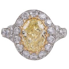 2.65 Carat Fancy Yellow Oval Diamond Gold Platinum Cluster Ring