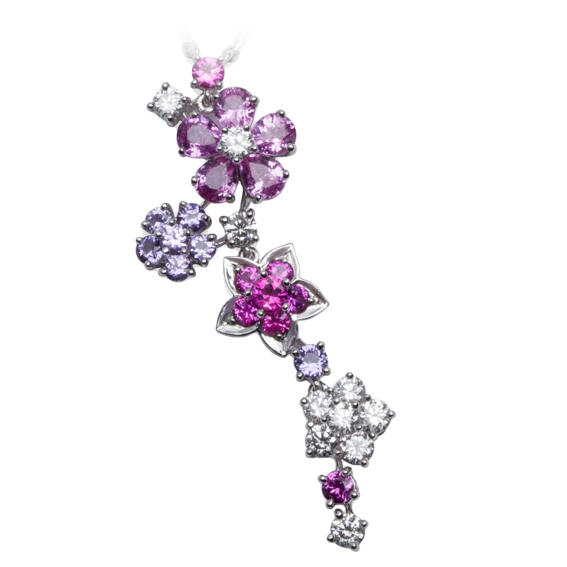 Van Cleef and Arpels diamond and sapphire Folie des Prés pendant necklace in 18K white gold, on 18K white gold chain with bezel set diamond and sapphire accents. Pendant with round diamonds, round & tear drop pink sapphires, and mauve round