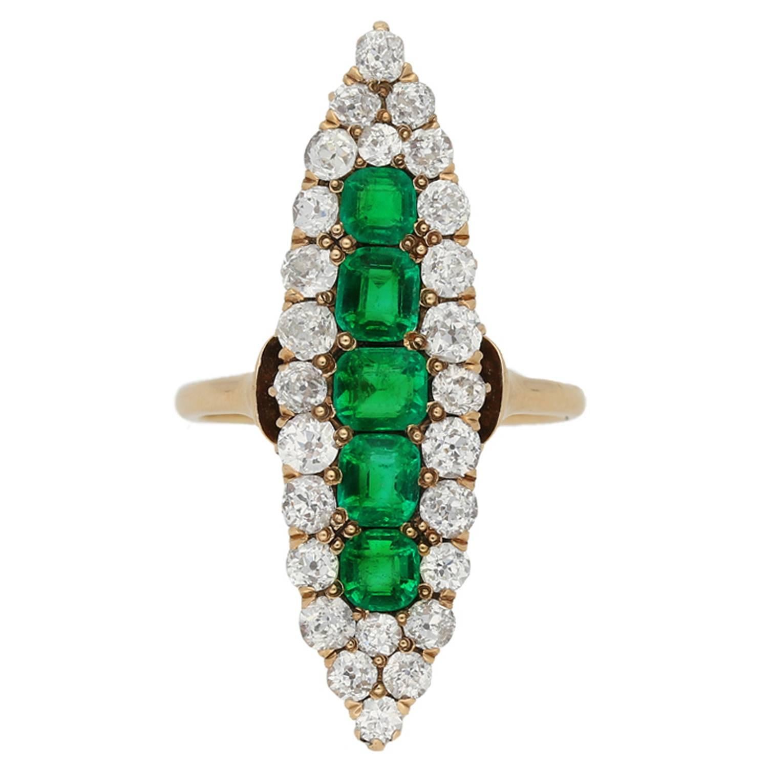 Antique marquise shape emerald and diamond ring, circa 1900. For Sale