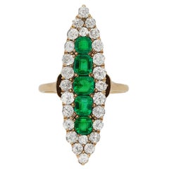 Antique marquise shape emerald and diamond ring, circa 1900.