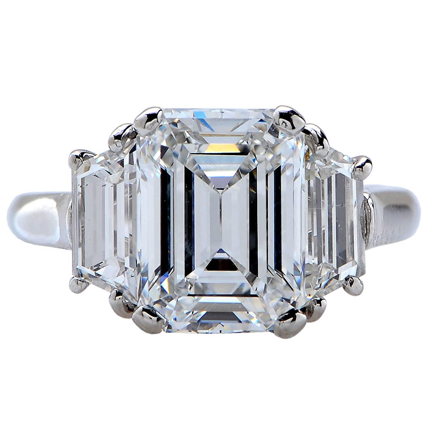 Platinum Ring Containing a 3.95 Carat E VS1 GIA Emerald Cut Diamond Flanked by Trapezoids Weighing Approximately 1.50 Carats Signed Webb.