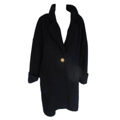 Vintage Chanel blue wool coat with signature coco buttons