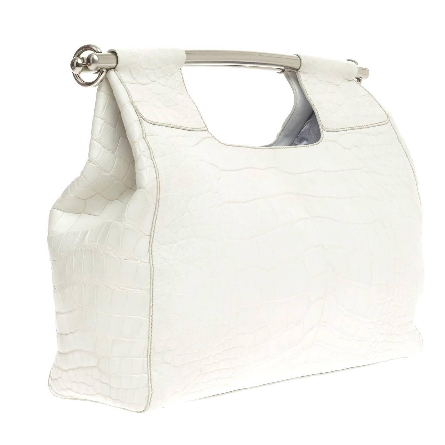 A stunning Prada Alligator Skin Handbag
Finest white mat soft exotic skin - no print
In excellent condition
Prada Triangle logo on side
Fully lined
One zipped inner pocket
Metal bar handel
Made in Italy
Comes with authenticity card and
