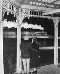 Mr. and Mrs. Ben Pope watch the last steam powered passenger train