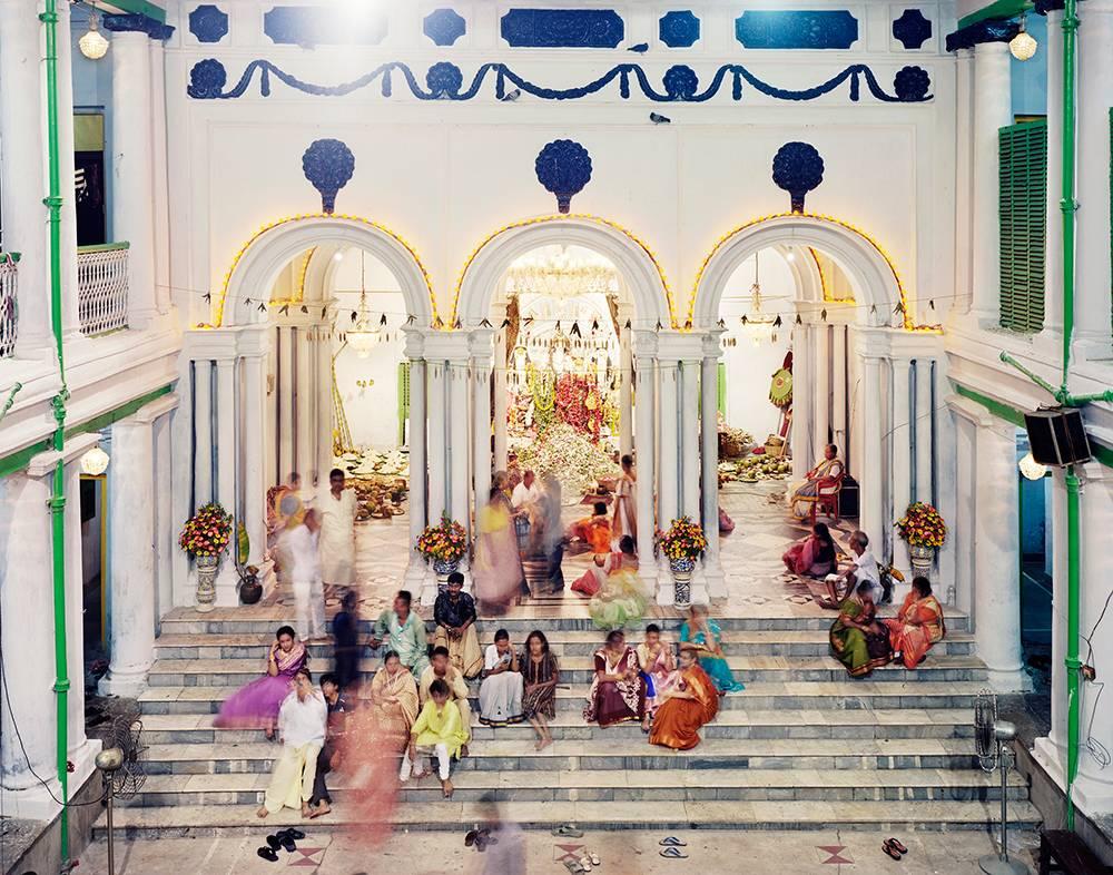 Laura McPhee Color Photograph - Family Gathering During Durga Puja, Dwarika House, Noth Kalkata