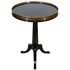 French Style Ebonized and Gilt Black Glass Top Gueridon Table