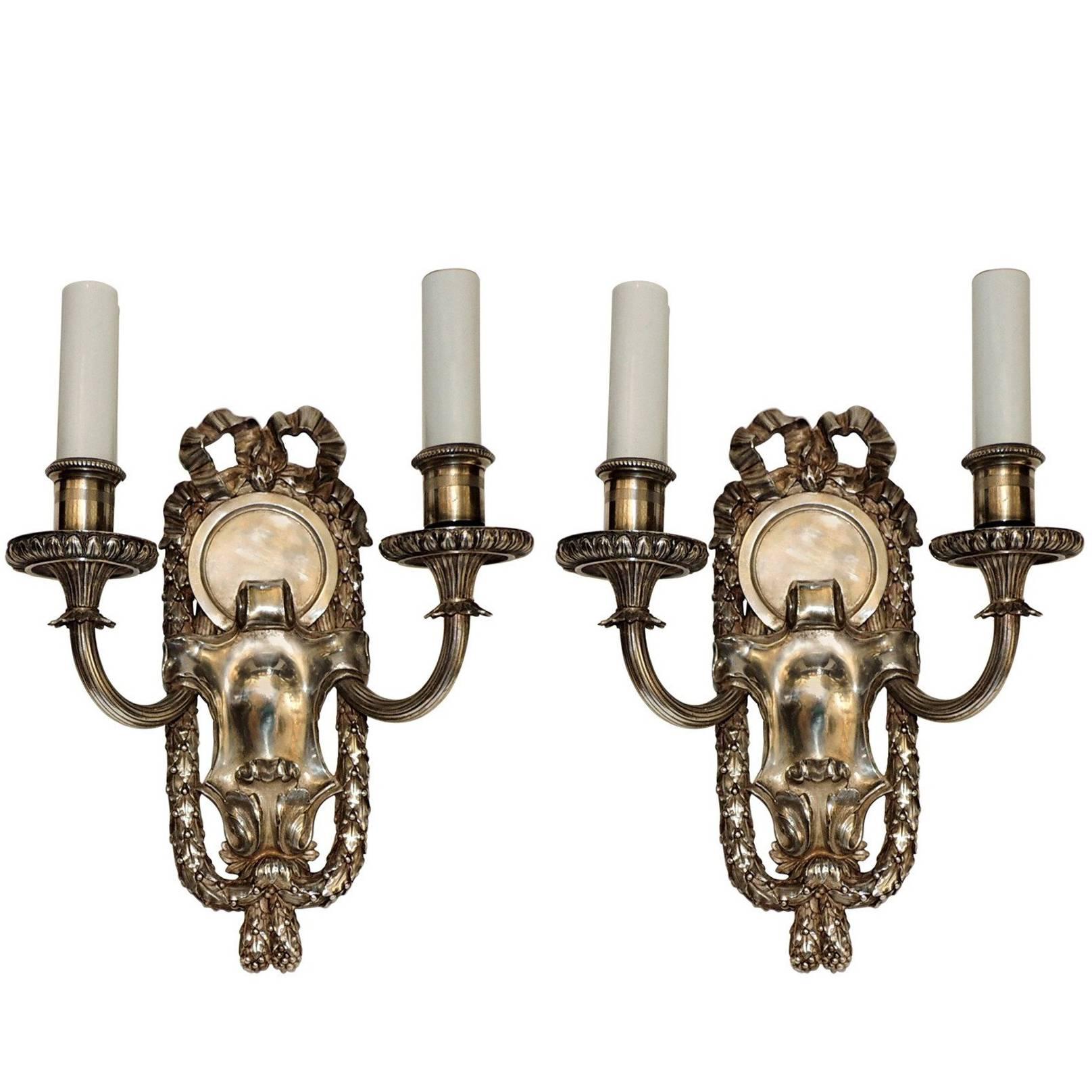 Elegant Pair of E.F. Caldwell Silvered Bronze Two-Arm Neoclassical Bow Sconces
