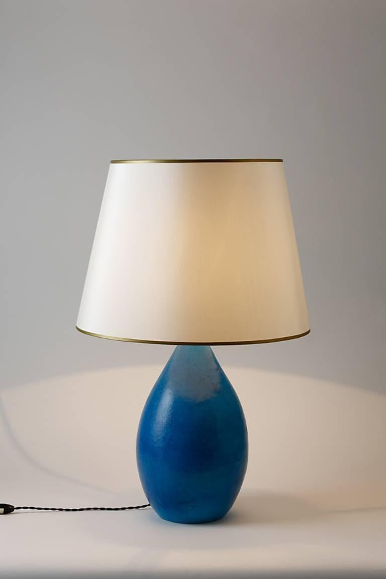 An elegant blue ceramic lamp by Raoul Lachenal.
Handwritten signature under the base 