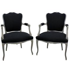 A Pair of French Open Armchairs in a Distressed Grey