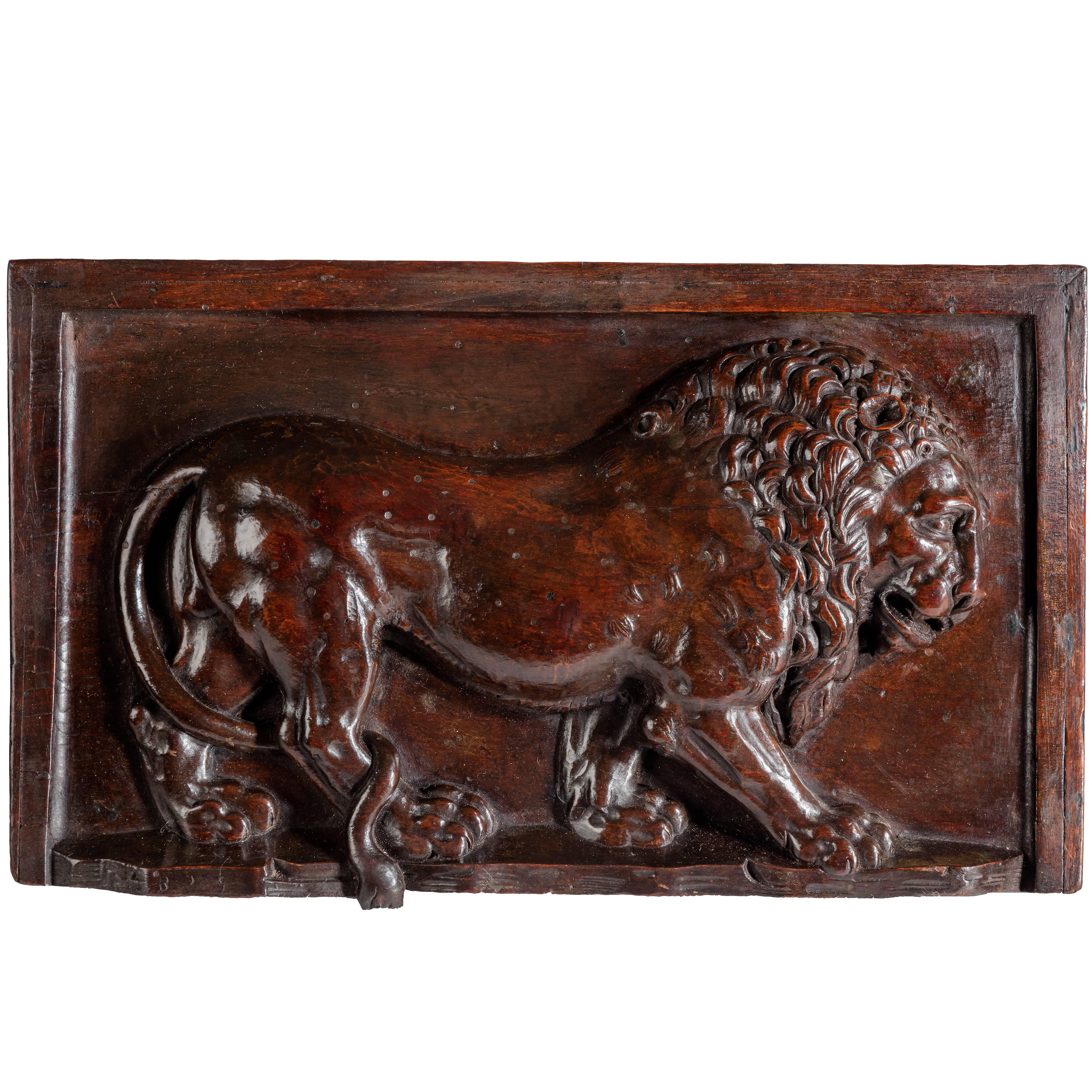 Carved Walnut Panel Depicting a Lion 