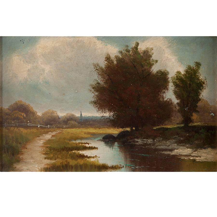 A beautifully executed small oil painting of a river landscape with a church steeple in the background and a wooded path winding along the river bank. Oil on panel
Measures: 12