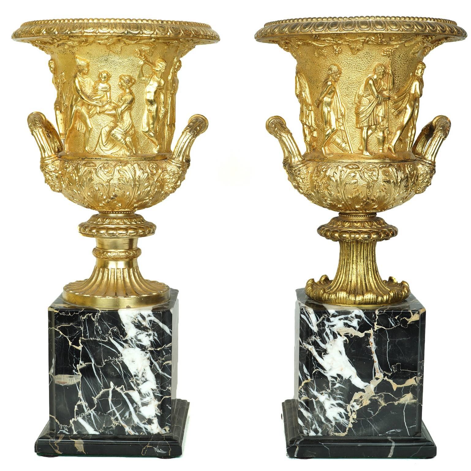 Pair of Neoclassical Gilt Bronze Figural Medici Style Urns on Marble Base 
