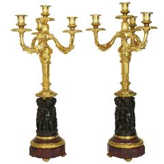 Pair of Two-Toned Bronze and Marble Figural Cherub Candelabras
