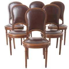 Set of Six Louis XVI Walnut Balloon Back Dining Chairs