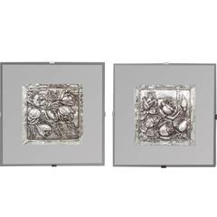 Pair of Silver Floral Reposed Elements in a Mirrored Frame