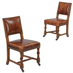 Pair of English Carved Oak Antique Leather Side Chairs, Early 20th Century