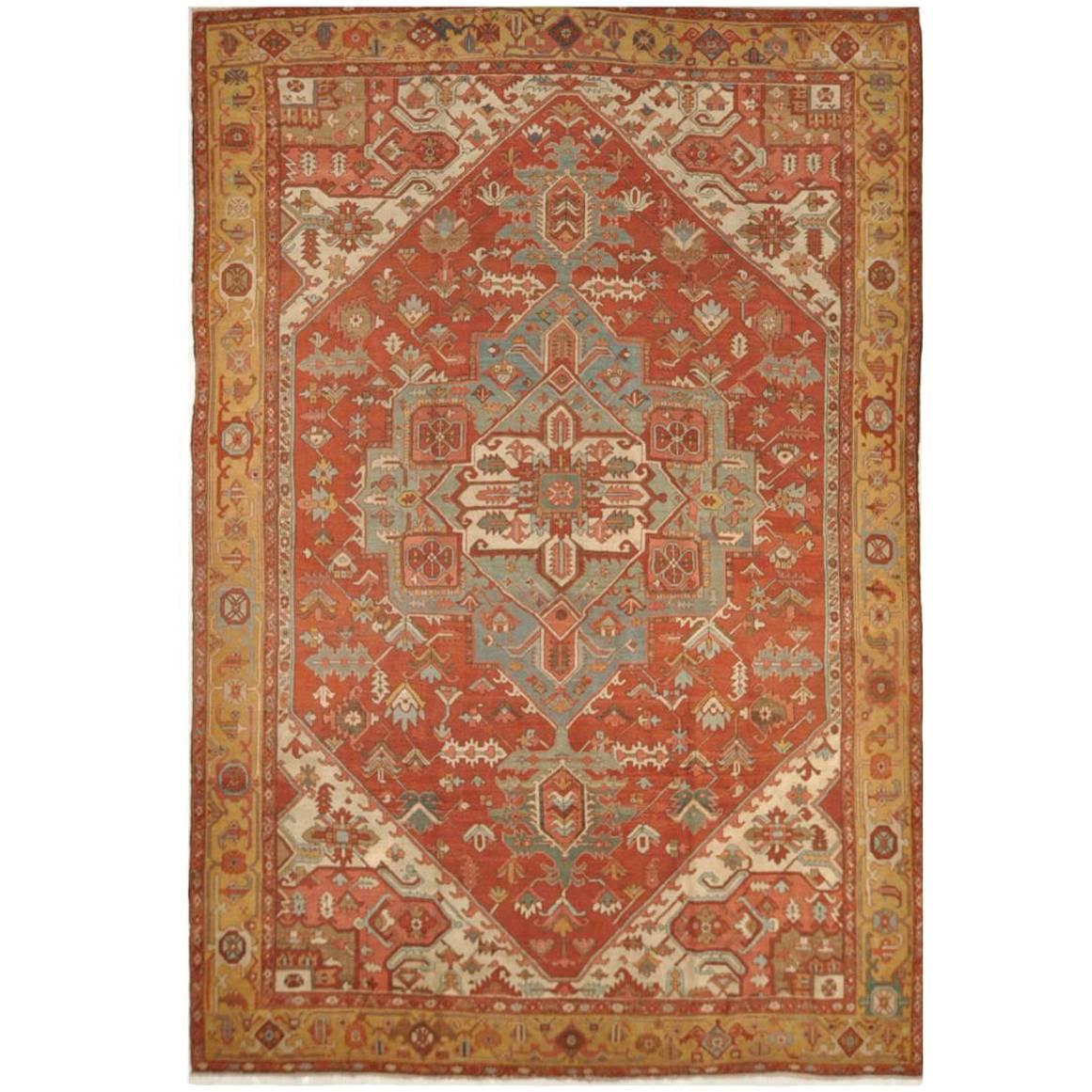 Large Room Size Antique Hand Knotted wool Red Teal and Gold Persian Serapi Rug For Sale