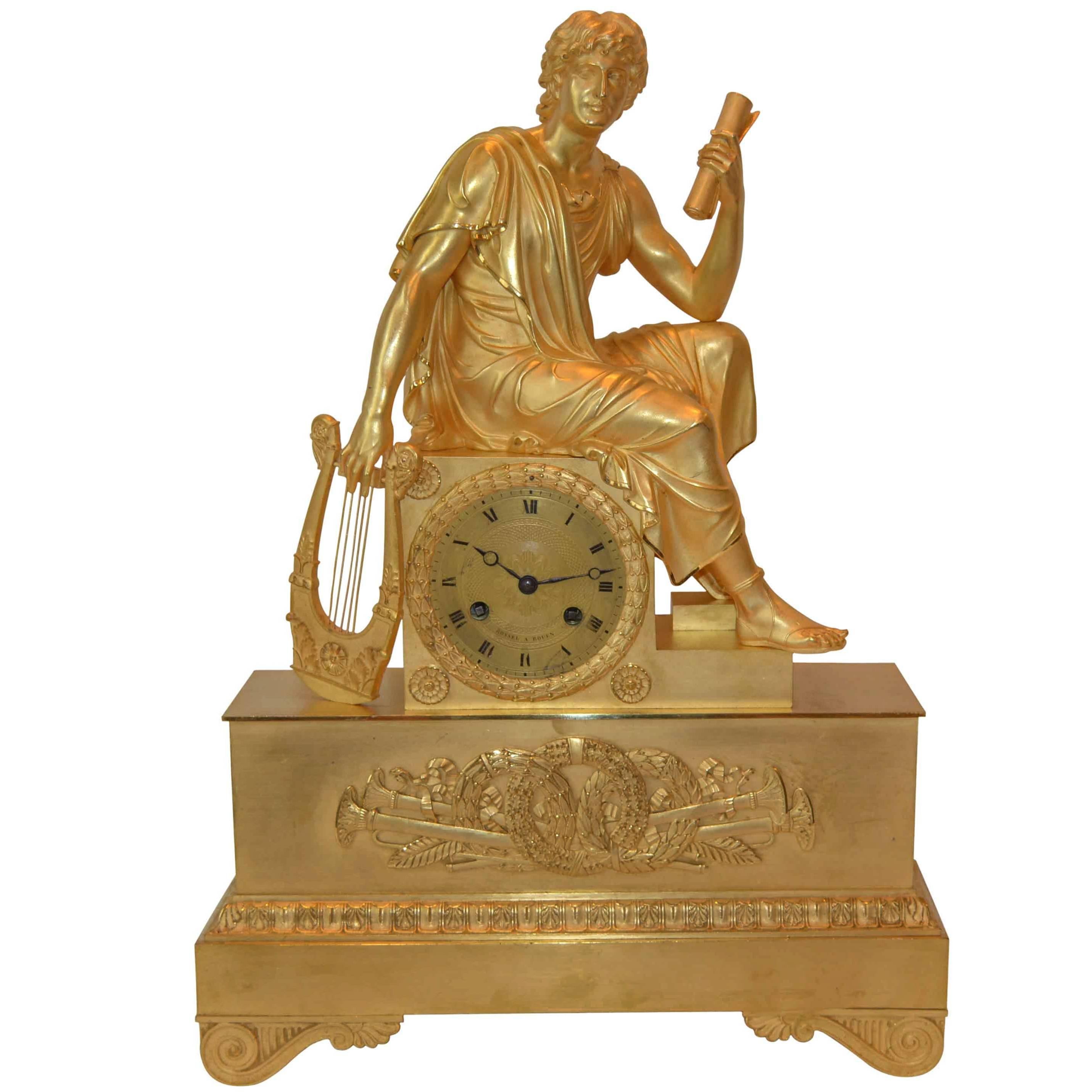 Empire Clock of a Seated Youth Holding a Scroll and Lyre For Sale