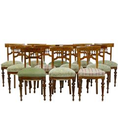 Harlequin Set of 12 Walnut Spindle Back Dining Chairs
