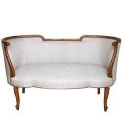 Elegant and Shapely French Rococo Style Carved Fruitwood Settee