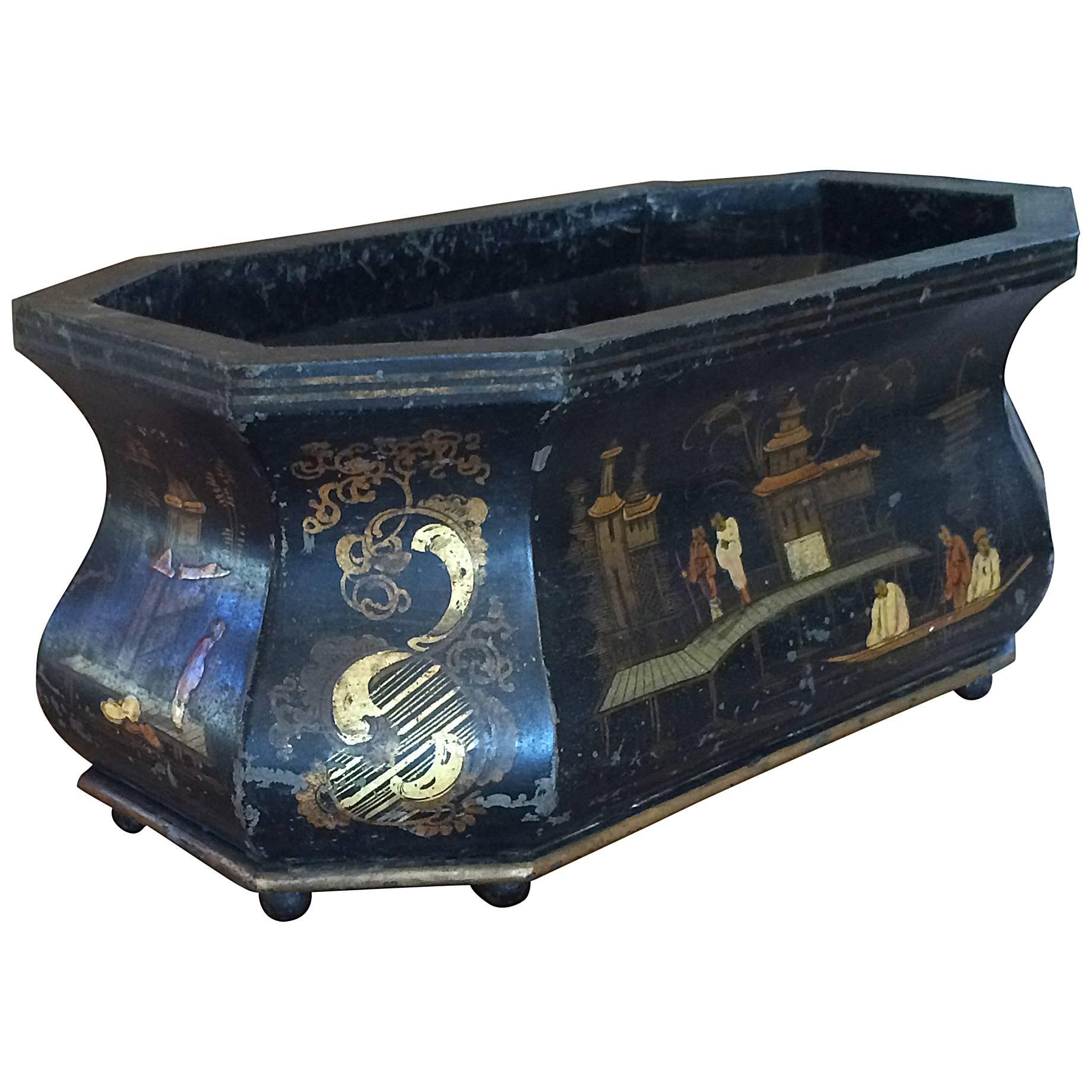 Very rare octagonal oval shaped Japanned tole jardiniere with chinoiserie imagery; ball feet; 19th century.